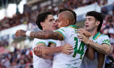 Roma's Donyell Malen, number 14, celebrates after scoring his side's first goal, during the Serie A soccer match between Bologna, in Bologna, Italy, Saturday, April 25, 2026. (Massimo Paolone/LaPresse via AP)