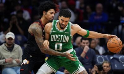 Boston Celtics' Jayson Tatum, right, tries to get past Philadelphia 76ers' Kelly Oubre Jr. during the second half of Game 4 in a first-round NBA basketball playoffs series Sunday, April 26, 2026, in Philadelphia. (AP Photo/Matt Slocum)