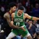 Boston Celtics' Jayson Tatum, right, tries to get past Philadelphia 76ers' Kelly Oubre Jr. during the second half of Game 4 in a first-round NBA basketball playoffs series Sunday, April 26, 2026, in Philadelphia. (AP Photo/Matt Slocum)