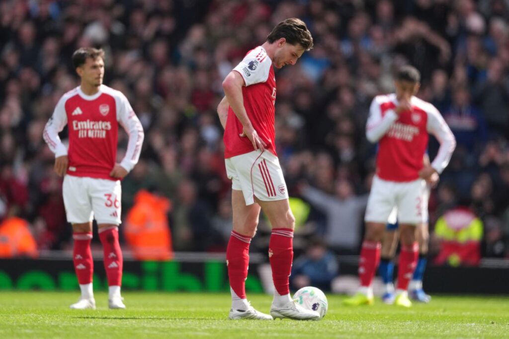 Arsenal's Declan Rice stands dejeted after conceding a goal during the Premier League soccer match between Arsenal and Bournemouth in London, England Saturday, April 11, 2026. (AP Photo/Dave Shopland)