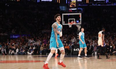 Charlotte Hornets' LaMelo Ball, center, reacts after scoring during the first half of an NBA basketball game against the New York Knicks, Sunday, April 12, 2026, in New York. (AP Photo/Pamela Smith)