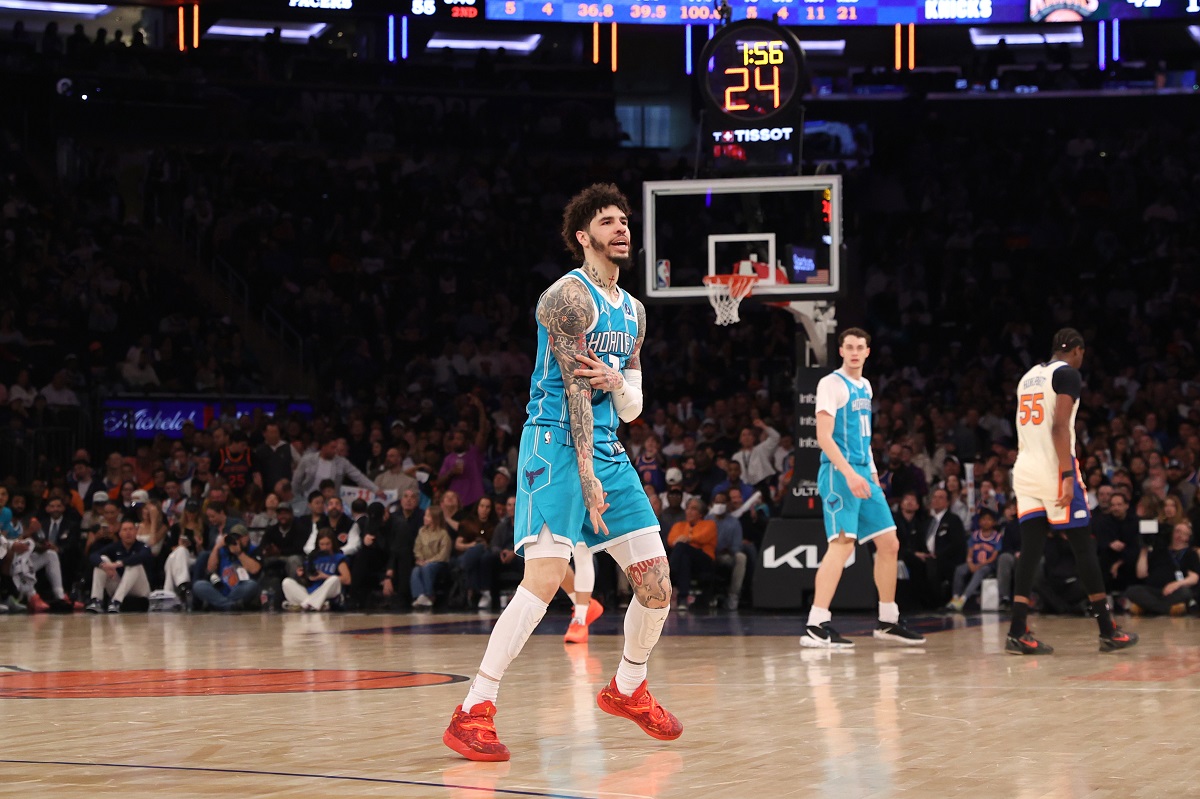 Charlotte Hornets' LaMelo Ball, center, reacts after scoring during the first half of an NBA basketball game against the New York Knicks, Sunday, April 12, 2026, in New York. (AP Photo/Pamela Smith)