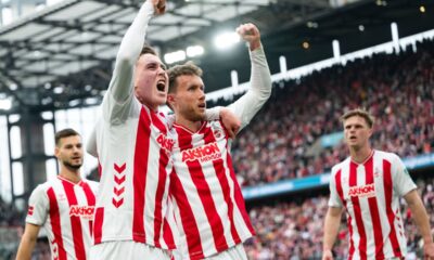 Koln's Isak Johannesson, centre left, celebrates Luca Waldschmidt after scoring his side's third goal with during German Bundesliga soccer match between 1. FC Koln and Werder Bremen and Werder Bremen, in Cologne, Germany, Sunday, April 12, 2026. (Marius Becker/dpa via AP)