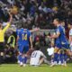 Referee Clement Turpin shows a red card to Italy's Alessandro Bastoni (21) during the World Cup qualifying playoff final soccer match between Bosnia and Italy in Zenica, Bosnia, Tuesday, March 31, 2026. . (Fabio Ferrari/LaPresse via AP)