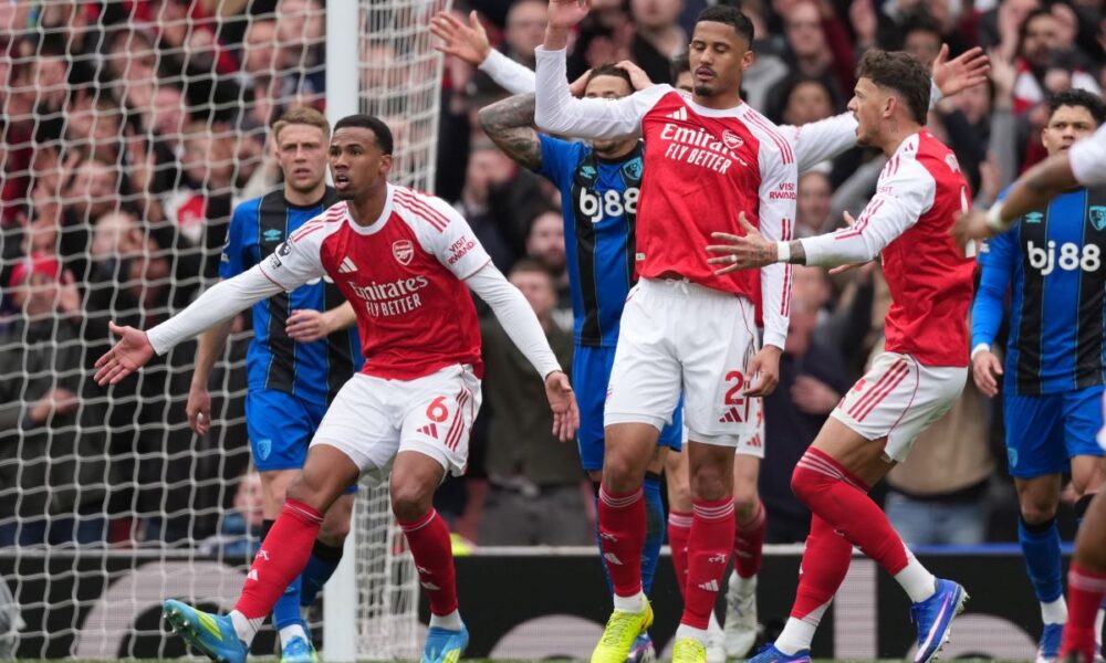 Arsenal players demand a penalty call after a hand play during the Premier League soccer match between Arsenal and Bournemouth in London, England Saturday, April 11, 2026. (AP Photo/Dave Shopland)