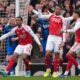 Arsenal players demand a penalty call after a hand play during the Premier League soccer match between Arsenal and Bournemouth in London, England Saturday, April 11, 2026. (AP Photo/Dave Shopland)