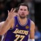 Los Angeles Lakers guard Luka Doncic (77) gestures after a three-point basket against the Indiana Pacers during the first half of an NBA basketball game in Indianapolis, Wednesday, March 25, 2026. (AP Photo/Michael Conroy)