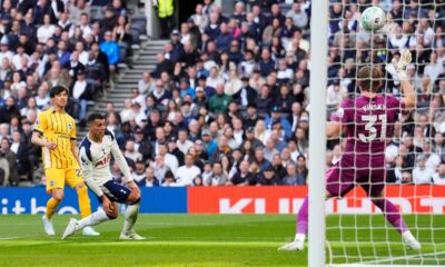 Brighton and Hove Albion's Kaoru Mitoma, left, scores their side's first goal of the game during their English Premier League soccer match against Tottenham in London, Saturday, April 18, 2026. (Jordan Pettitt/PA via AP)
