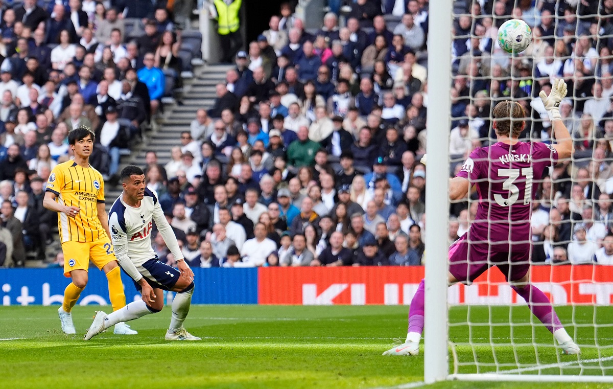 Brighton and Hove Albion's Kaoru Mitoma, left, scores their side's first goal of the game during their English Premier League soccer match against Tottenham in London, Saturday, April 18, 2026. (Jordan Pettitt/PA via AP)