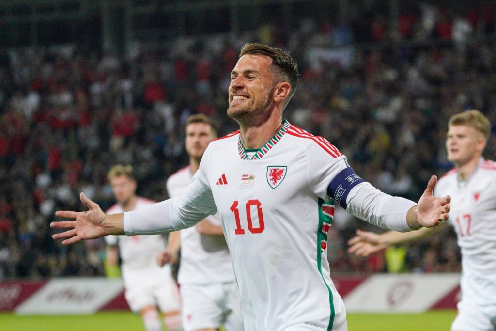 FILE - Wales' Aaron Ramsey celebrates after scoring his side's opening goal during the Euro 2024 group D qualifying soccer match between Latvia and Wales in Riga, Latvia, on Sept. 11, 2023. (AP Photo/Roman Koksarov, File)
