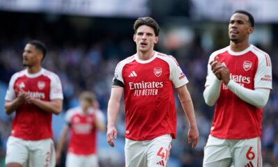 Arsenal's Declan Rice and his teammate Gabriel react at the end of the English Premier League soccer match between Manchester City and and Arsenal, in Manchester, England, Sunday, April 19, 2026. (AP Photo/Dave Thompson)