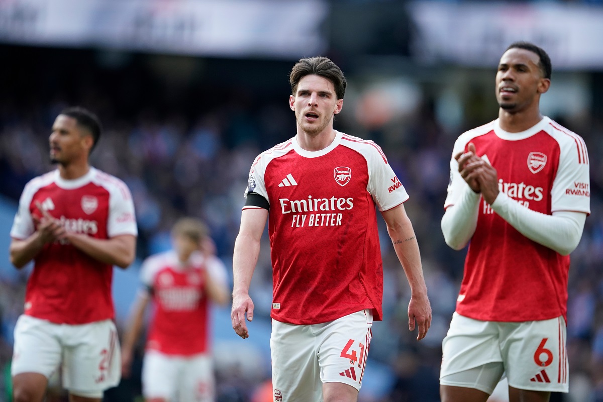 Arsenal's Declan Rice and his teammate Gabriel react at the end of the English Premier League soccer match between Manchester City and and Arsenal, in Manchester, England, Sunday, April 19, 2026. (AP Photo/Dave Thompson)