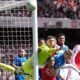 Bournemouth's goalkeeper Djordje Petrovic punches the ball during the Premier League soccer match between Arsenal and Bournemouth in London, England Saturday, April 11, 2026. (AP Photo/Dave Shopland)