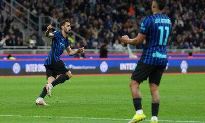 Inter Milan's Hakan Calhanoglu celebrates after scoring his side's opening goal during the Italian Cup, return-leg soccer match between Inter Milan and Como, in Milan, Italy, Tuesday, April 21, 2026. (AP Photo/Luca Bruno)