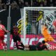 Bayern's Harry Kane scores his side's opening goal during the German Soccer Cup semifinal match between Bayer Leverkusen and Bayern Munich in Leverkusen, Germany, Wednesday, April 22, 2026. (AP Photo/Martin Meissner)