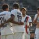 PSG's Senny Mayulu, left, celebrates with his teammates after scoring his side's second goal during the French League One soccer match between Angers and Paris Saint-Germain in Angers, western France, Saturday, April 25, 2026. (AP Photo/Mathieu Pattier)