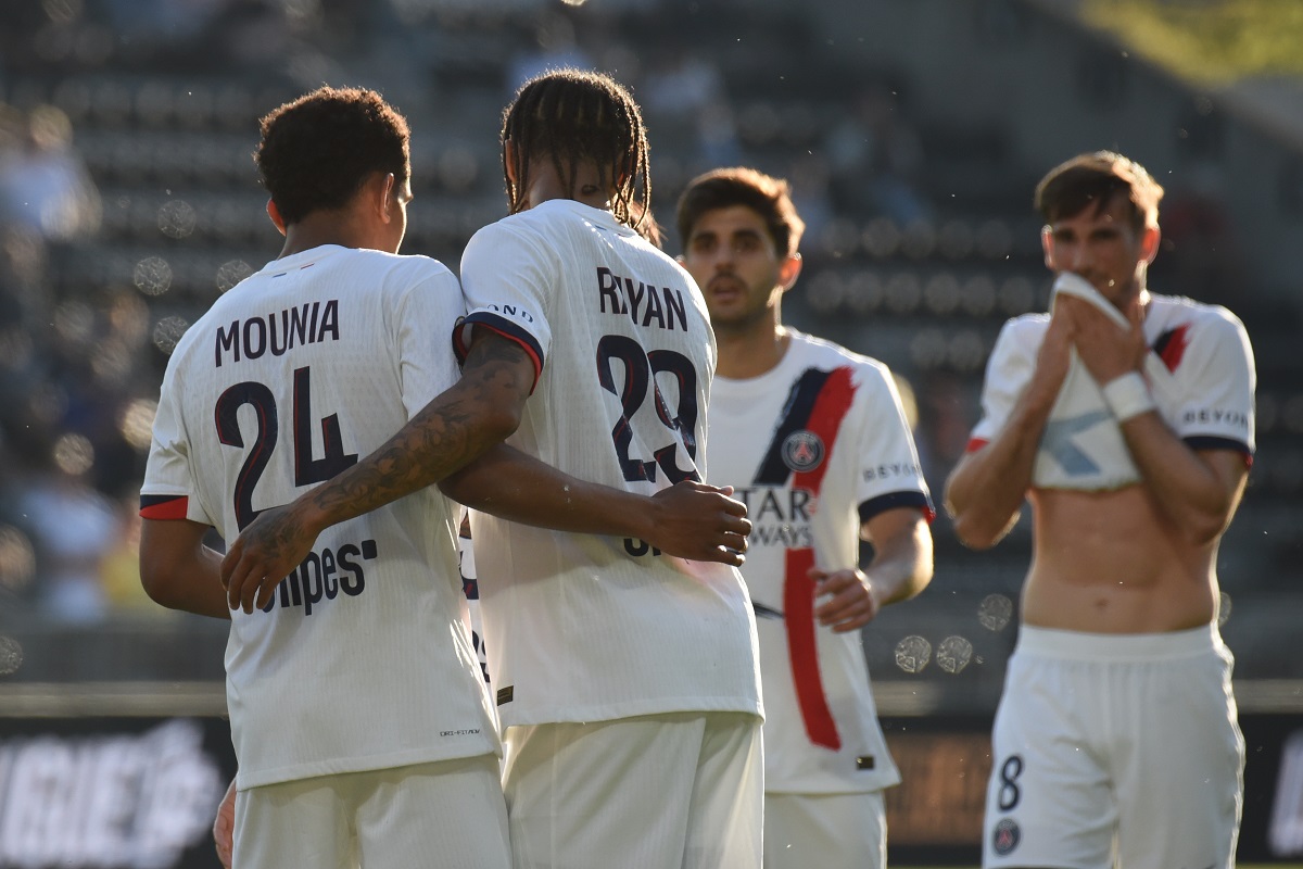 PSG's Senny Mayulu, left, celebrates with his teammates after scoring his side's second goal during the French League One soccer match between Angers and Paris Saint-Germain in Angers, western France, Saturday, April 25, 2026. (AP Photo/Mathieu Pattier)