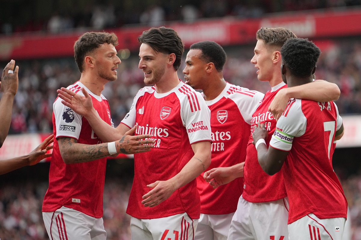 Arsenal's Viktor Gyoekeres, second right, celebrates with teammates after scoring his side's opening goal during the English Premier League soccer match between Arsenal and Fulham in London, England, Saturday, May 2, 2026. (AP Photo/Kin Cheung)