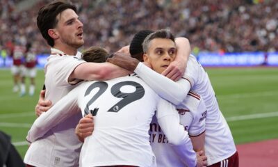 Arsenal players celebrate after scoring during the Premier League soccer match between West Ham and Arsenal in London, Sunday, May 10, 2026. (AP Photo/Ian Walton)