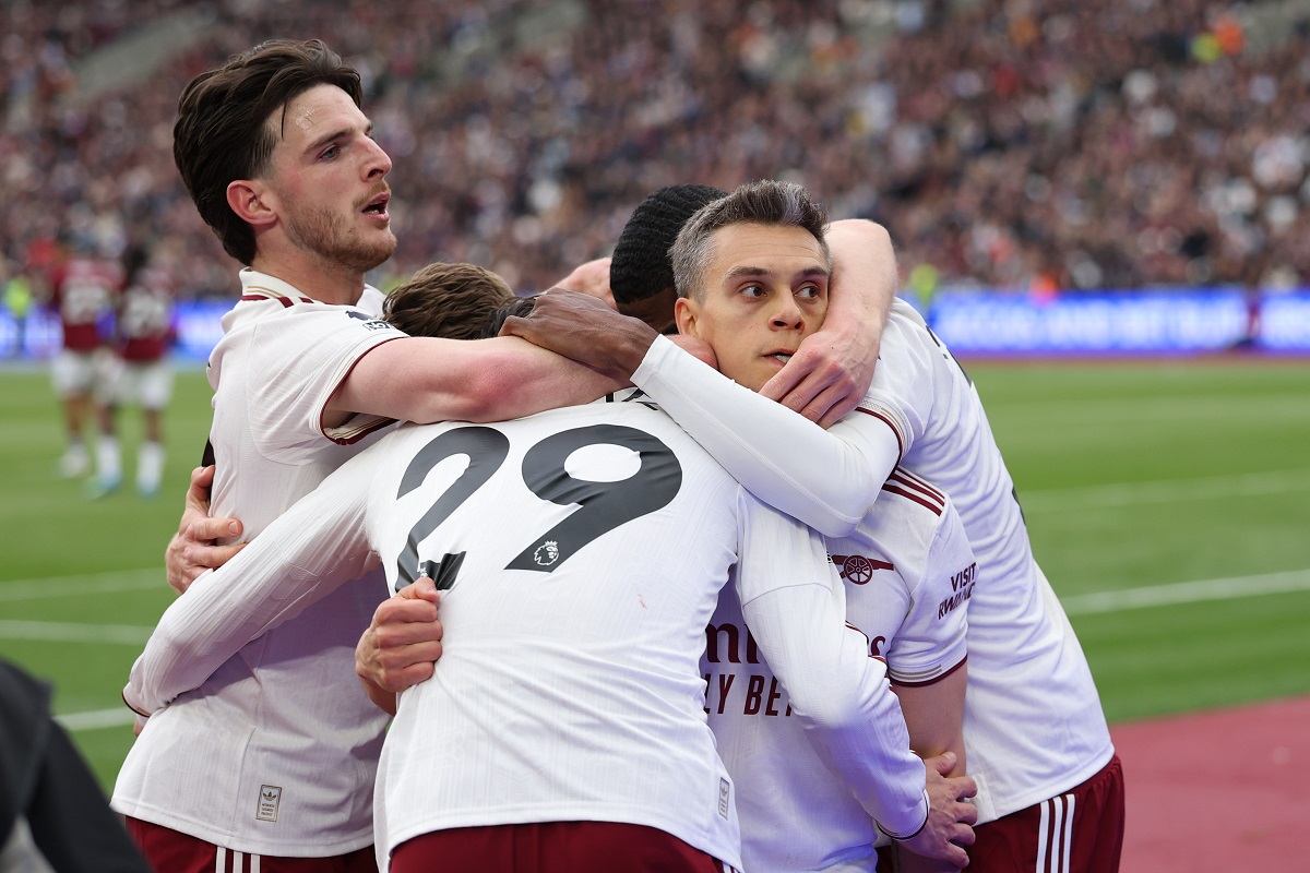 Arsenal players celebrate after scoring during the Premier League soccer match between West Ham and Arsenal in London, Sunday, May 10, 2026. (AP Photo/Ian Walton)