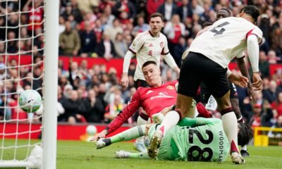 Manchester United's Benjamin Sesko, centre, scores his side's second goal during the English Premier League soccer match between Manchester United and Liverpool in Manchester, England, Sunday, May 3, 2026. (AP Photo/Dave Thompson)