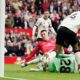 Manchester United's Benjamin Sesko, centre, scores his side's second goal during the English Premier League soccer match between Manchester United and Liverpool in Manchester, England, Sunday, May 3, 2026. (AP Photo/Dave Thompson)