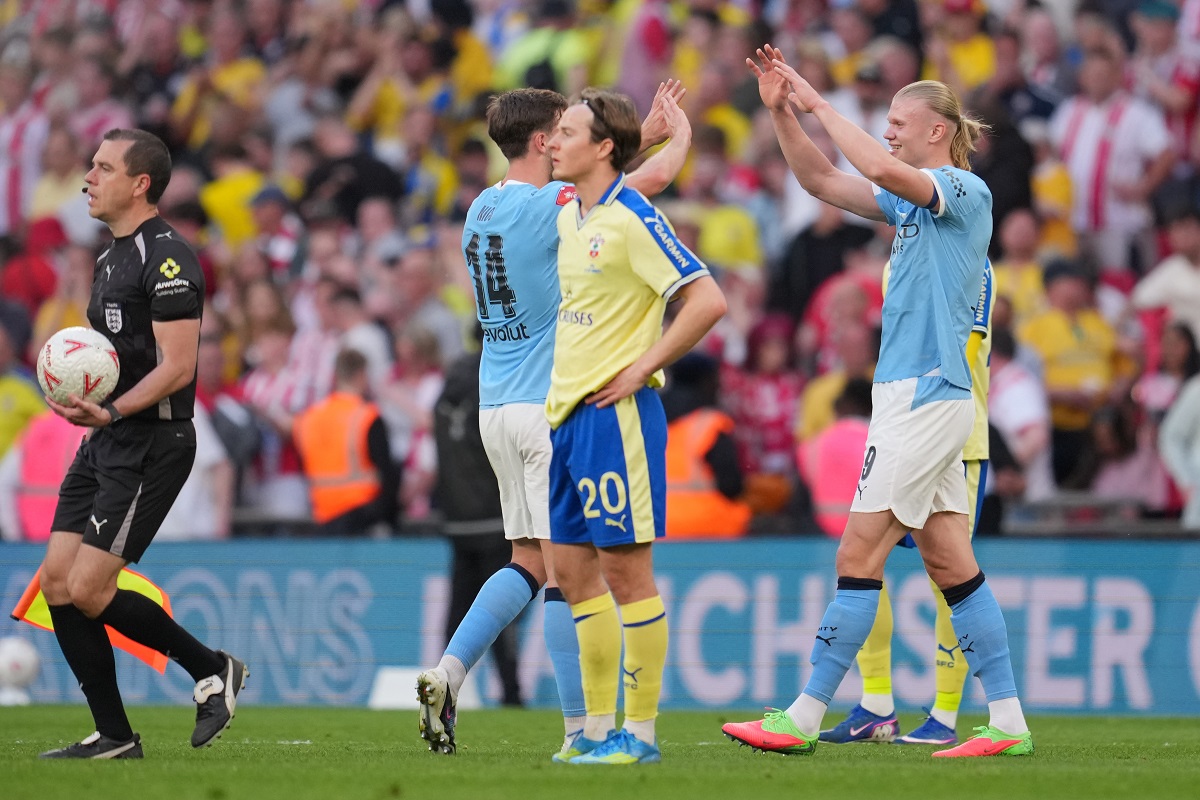 Manchester City's Nico Gonzalez, left, and Erling Haaland celebrate after the FA Cup semifinal soccer match between Manchester City and Southampton in Manchester, England, Saturday, April 25, 2026. (AP Photo/Kin Cheung)