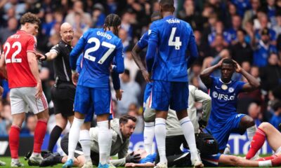 Chelsea's Jesse Derry is treated by medical staff after a clash of heads with Nottingham Forest's Zach Abbott during the English Premier League soccer match between Chelsea and Nottingham Forest in London, Monday, May 4, 2026. (John Walton/PA via AP)