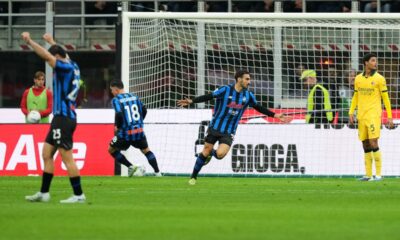 Atalanta's Davide Zappacosta, second right, celebrates with teammates after scoring his side's second goal during the Serie A soccer match between AC Milan and Atalanta, in Milan, Italy, Sunday, May 10, 2026. (AP Photo/Antonio Calanni)