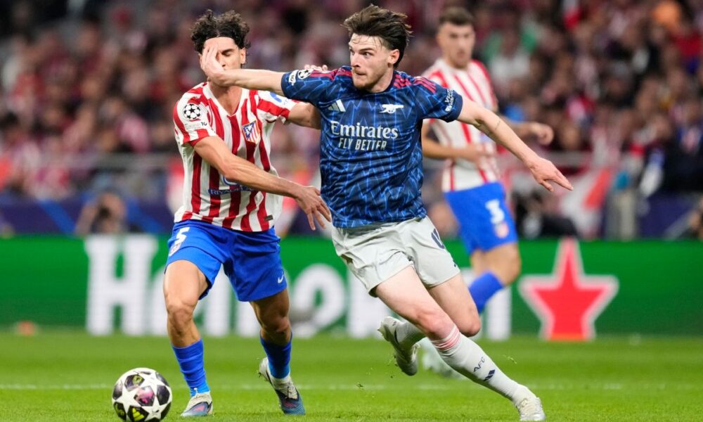 Arsenal's Declan Rice, right, and Atletico Madrid's Johnny Cardoso battle for the ball during a Champions League semifinal, first leg, soccer match between Atletico Madrid and Arsenal in Madrid, Spain, Wednesday, April 29, 2026. (AP Photo/Jose Breton)