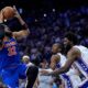 New York Knicks' Karl-Anthony Towns, from left, goes up for a shot against Philadelphia 76ers' Tyrese Maxey, and Joel Embiid during the first half of Game 4 in a second-round NBA basketball playoffs series Sunday, May 10, 2026, in Philadelphia. (AP Photo/Matt Slocum)