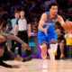 Oklahoma City Thunder guard Jared McCain, right, drives toward the basket as Los Angeles Lakers forward LeBron James falls during the second half of Game 4 in a second-round NBA basketball playoffs series Monday, May 11, 2026, in Los Angeles. (AP Photo/Mark J. Terrill)