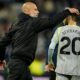 Manchester City's head coach Pep Guardiola hugs Bernardo Silva after the Premier League soccer match between Manchester City and Everton in Liverpool, England, Monday, May 4, 2026. (AP Photo/Dave Thompson)