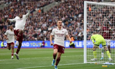 Arsenal's Leandro Trossard celebrates after scoring during the Premier League soccer match between West Ham and Arsenal in London, Sunday, May 10, 2026. (AP Photo/Ian Walton)