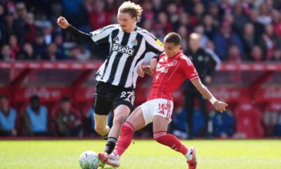 Newcastle United's Nick Woltemade, left, and Nottingham Forest's Nicolas Dominguez battle for the ball during the English Premier League soccer match between Nottingham Forest and Newcastle United in Nottingham, England, Sunday May 10, 2026. (Mike Egerton/PA via AP)