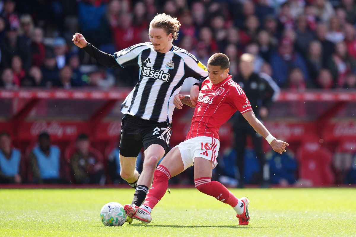 Newcastle United's Nick Woltemade, left, and Nottingham Forest's Nicolas Dominguez battle for the ball during the English Premier League soccer match between Nottingham Forest and Newcastle United in Nottingham, England, Sunday May 10, 2026. (Mike Egerton/PA via AP)