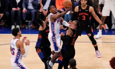 Philadelphia 76ers guard Tyrese Maxey (0) shoots over New York Knicks guard Jalen Brunson (11) during the second half of Game 2 in a second-round NBA basketball playoffs series, Wednesday, May 6, 2026, in New York. (AP Photo/Yuki Iwamura)