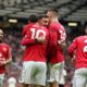 Manchester United players celebrate after scoring during the English Premier League soccer match between Manchester United and Liverpool in Manchester, England, Sunday, May 3, 2026. (AP Photo/Dave Thompson)